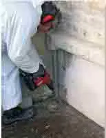 Traitement-termites-barrière-chimique-sol-prtection-par-injection-d'insecticide-bois et matériaux de maçonneries d'un immeuble bâti